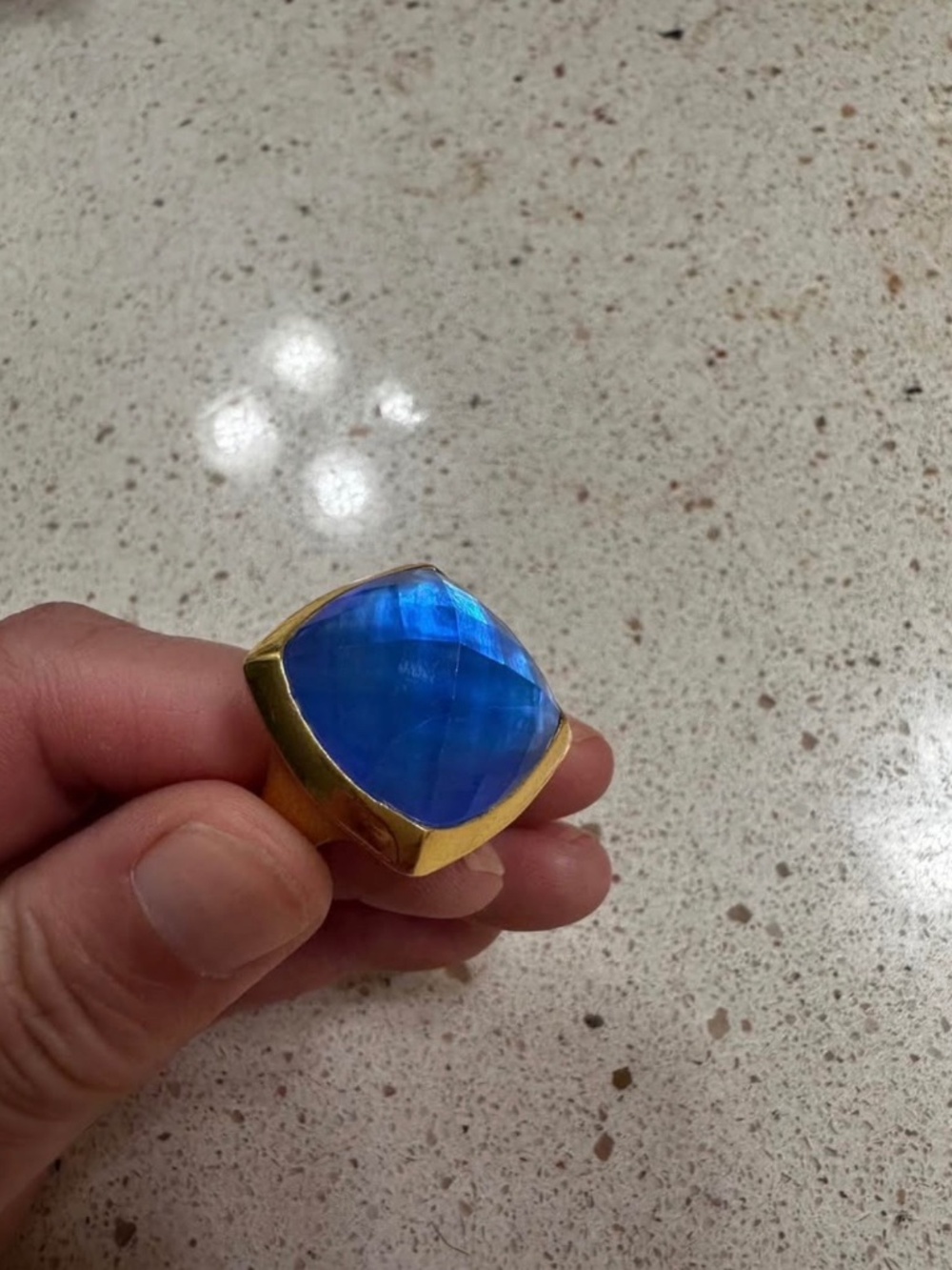Iridescent ocean blue glass ring backed with mother of pearl
